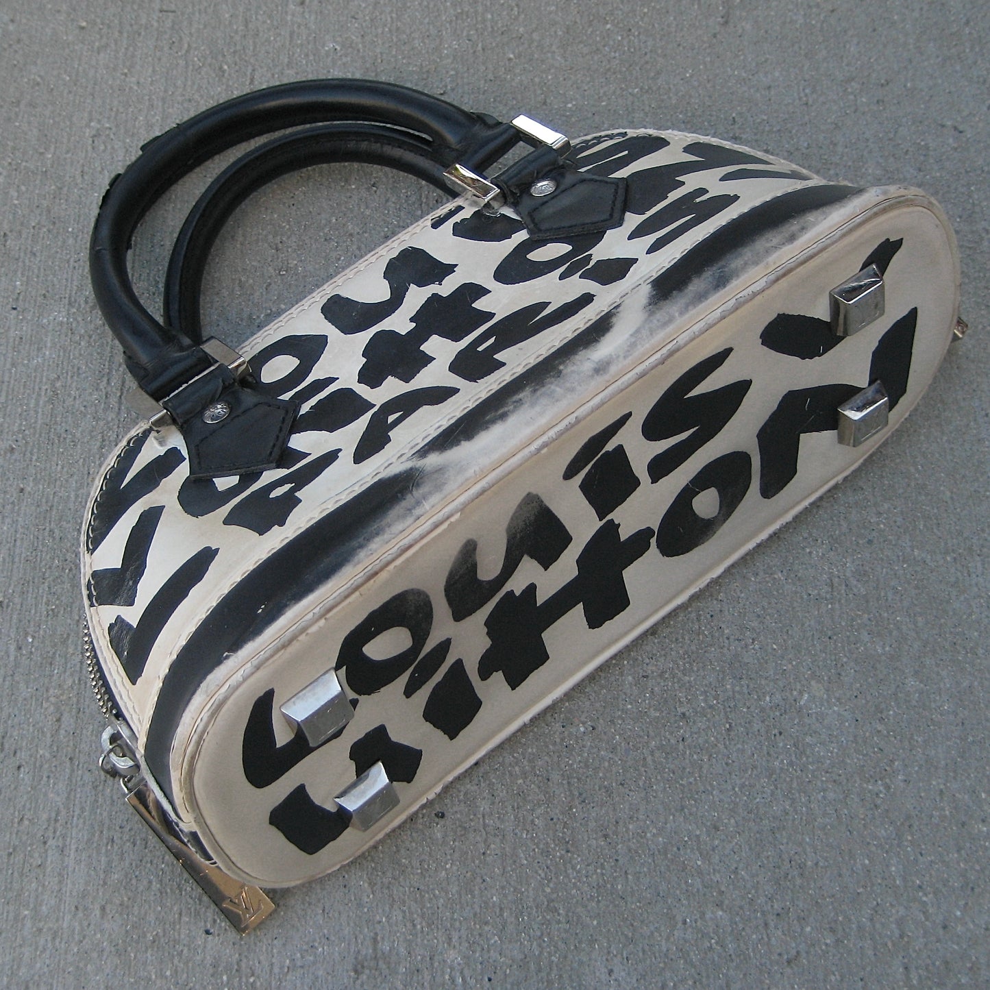 Louis Vuitton Alma MM white and black graffiti printed