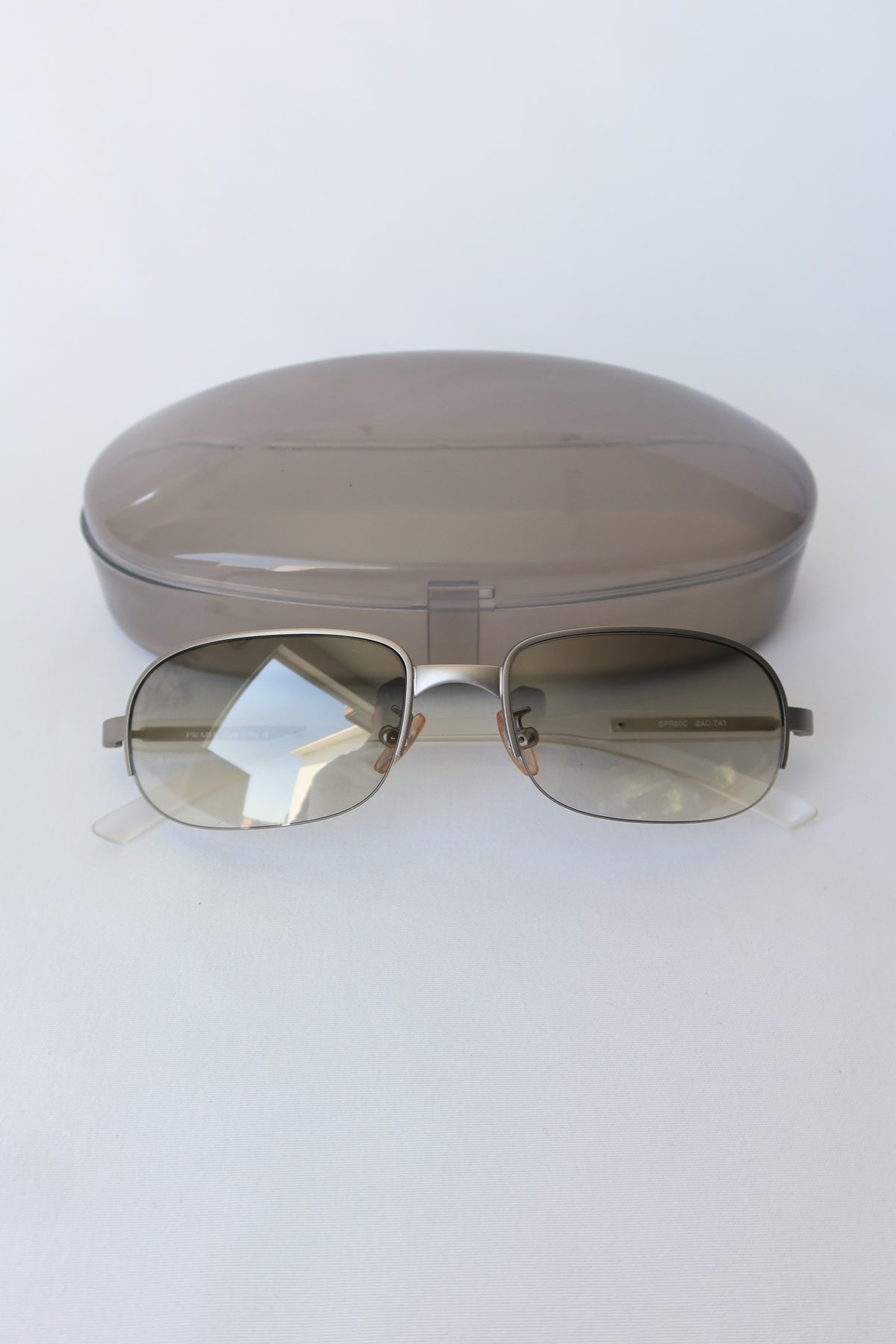 Prada Silver Rectangle Sunglasses · Case