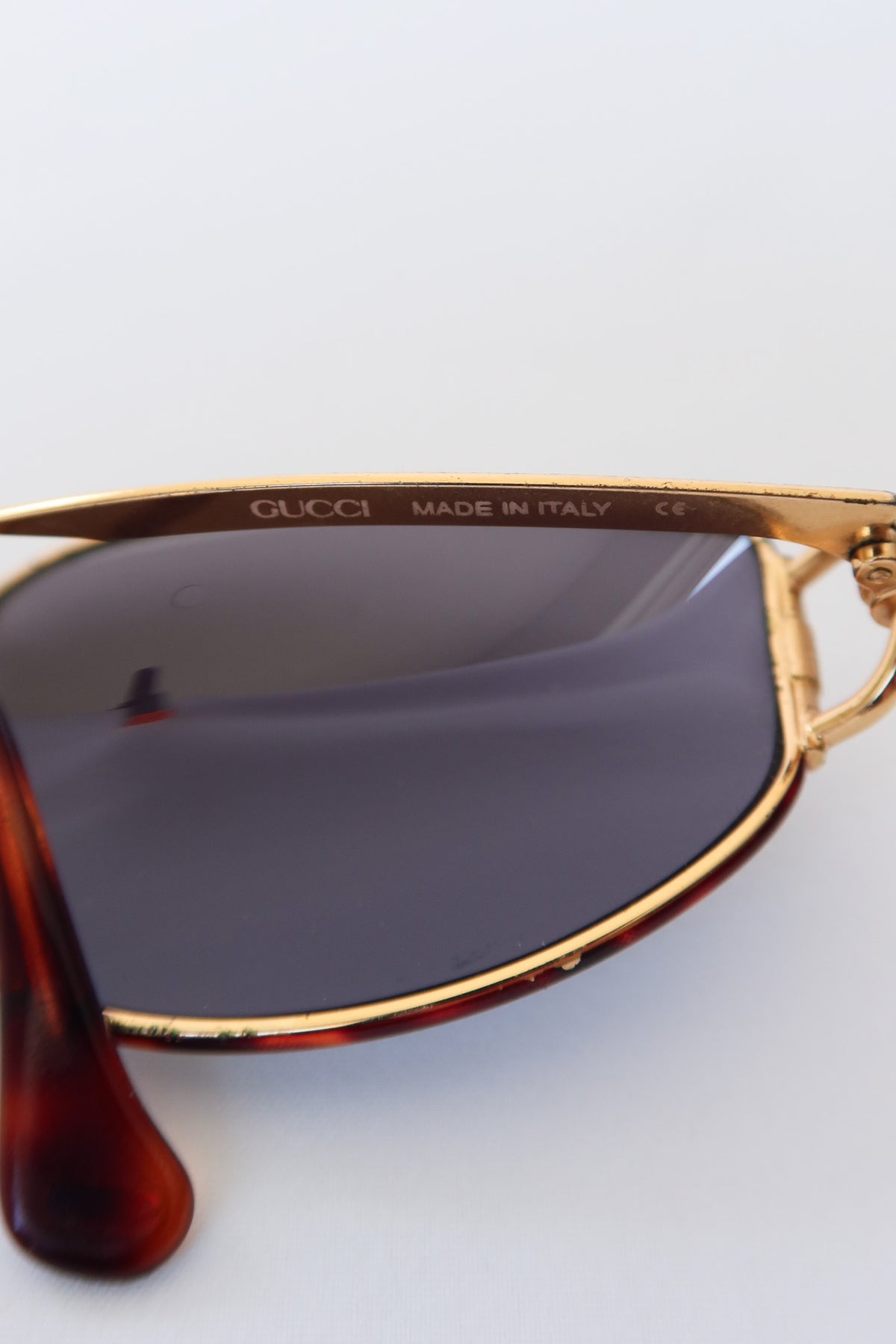 Gucci Gold Oval Knot Sunglasses