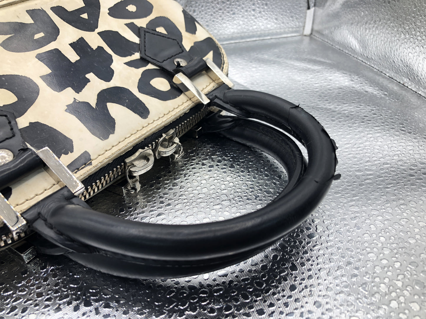 Louis Vuitton Alma MM white and black graffiti printed