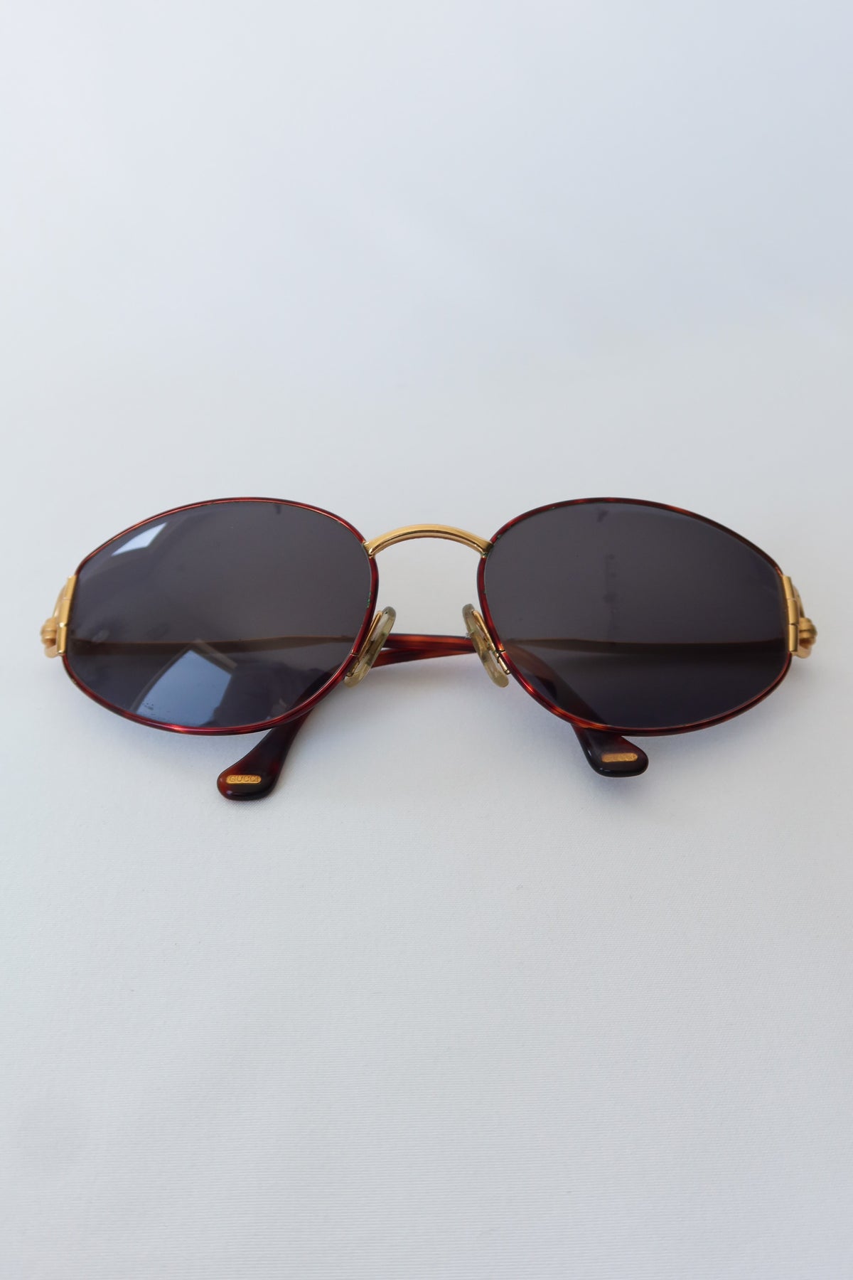 Gucci Gold Oval Knot Sunglasses