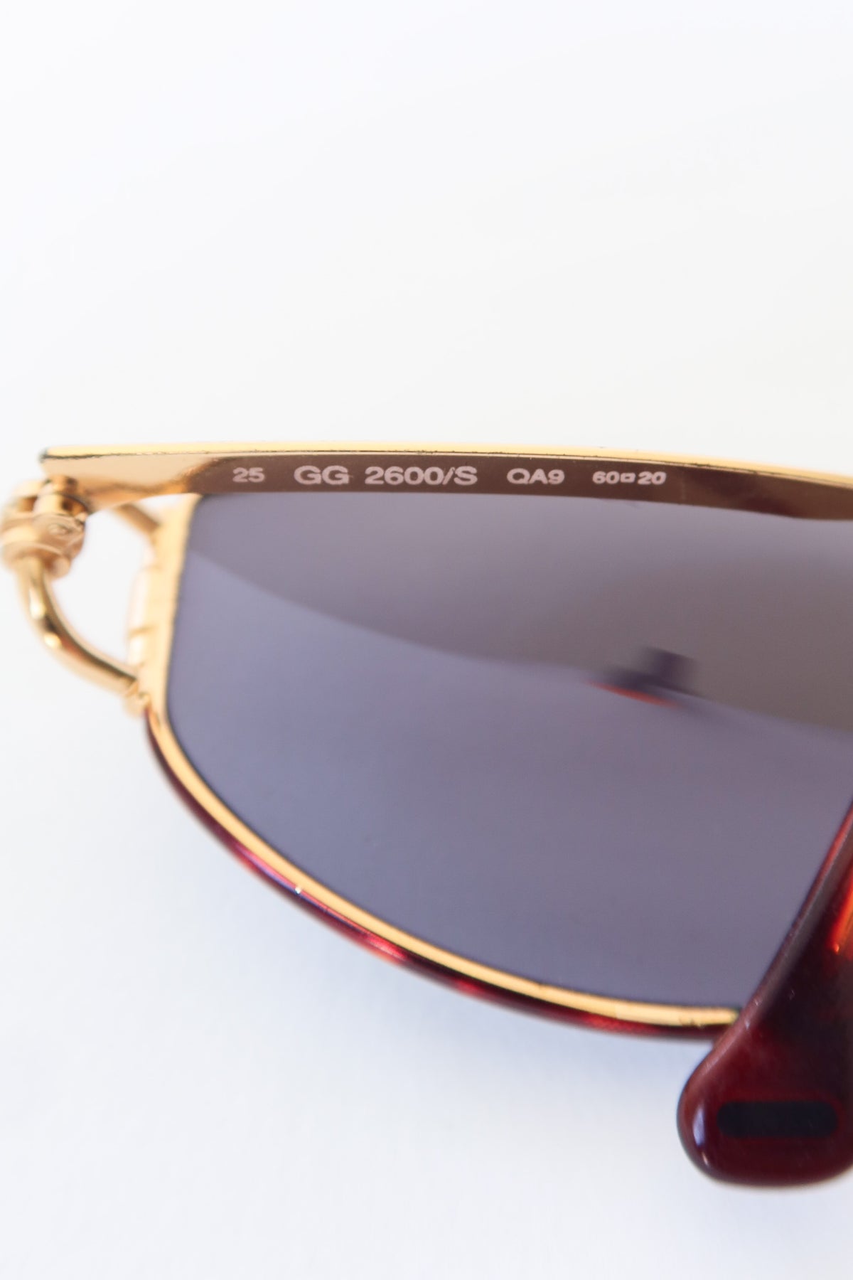 Gucci Gold Oval Knot Sunglasses