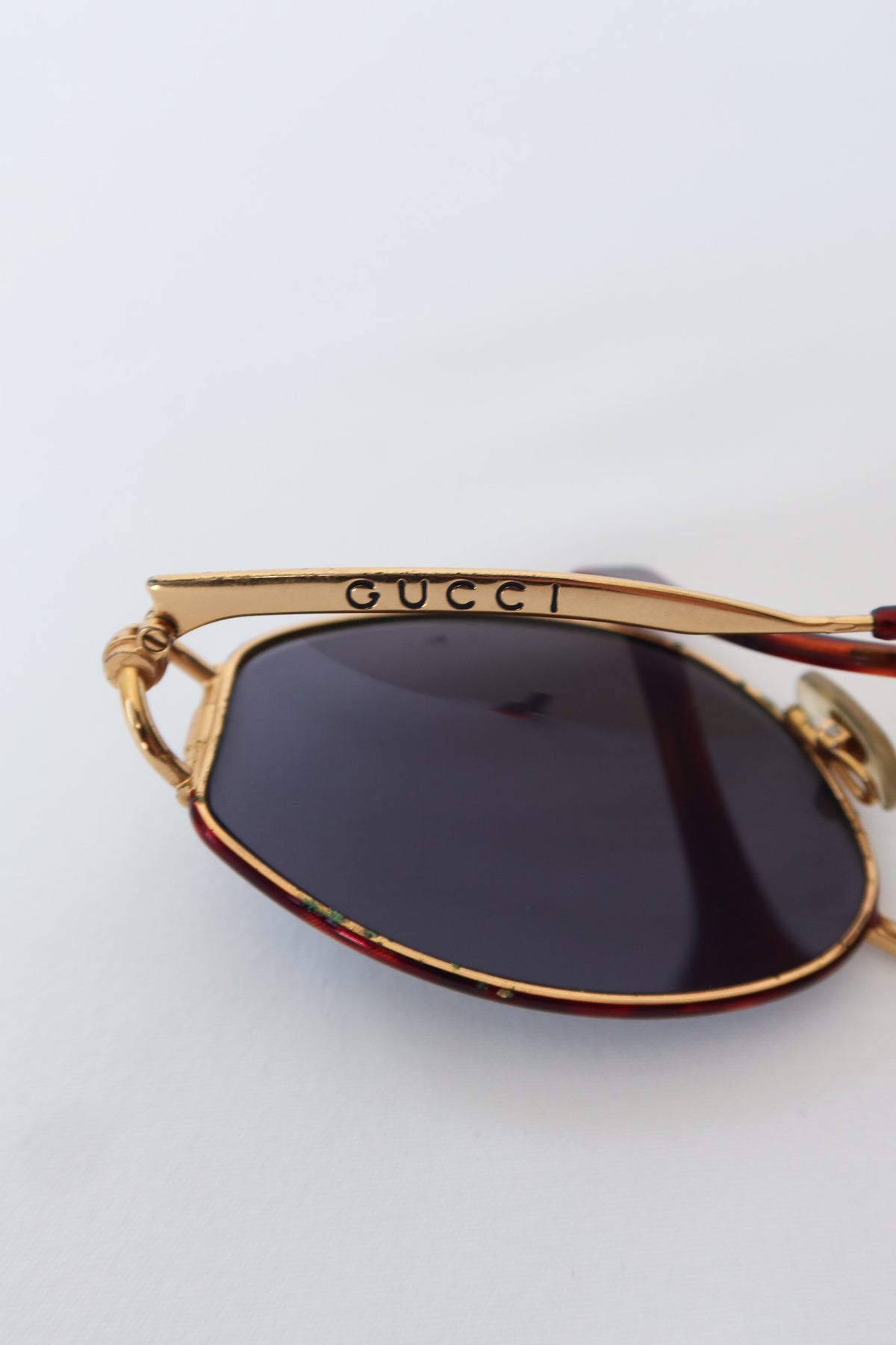 Gucci Gold Oval Knot Sunglasses