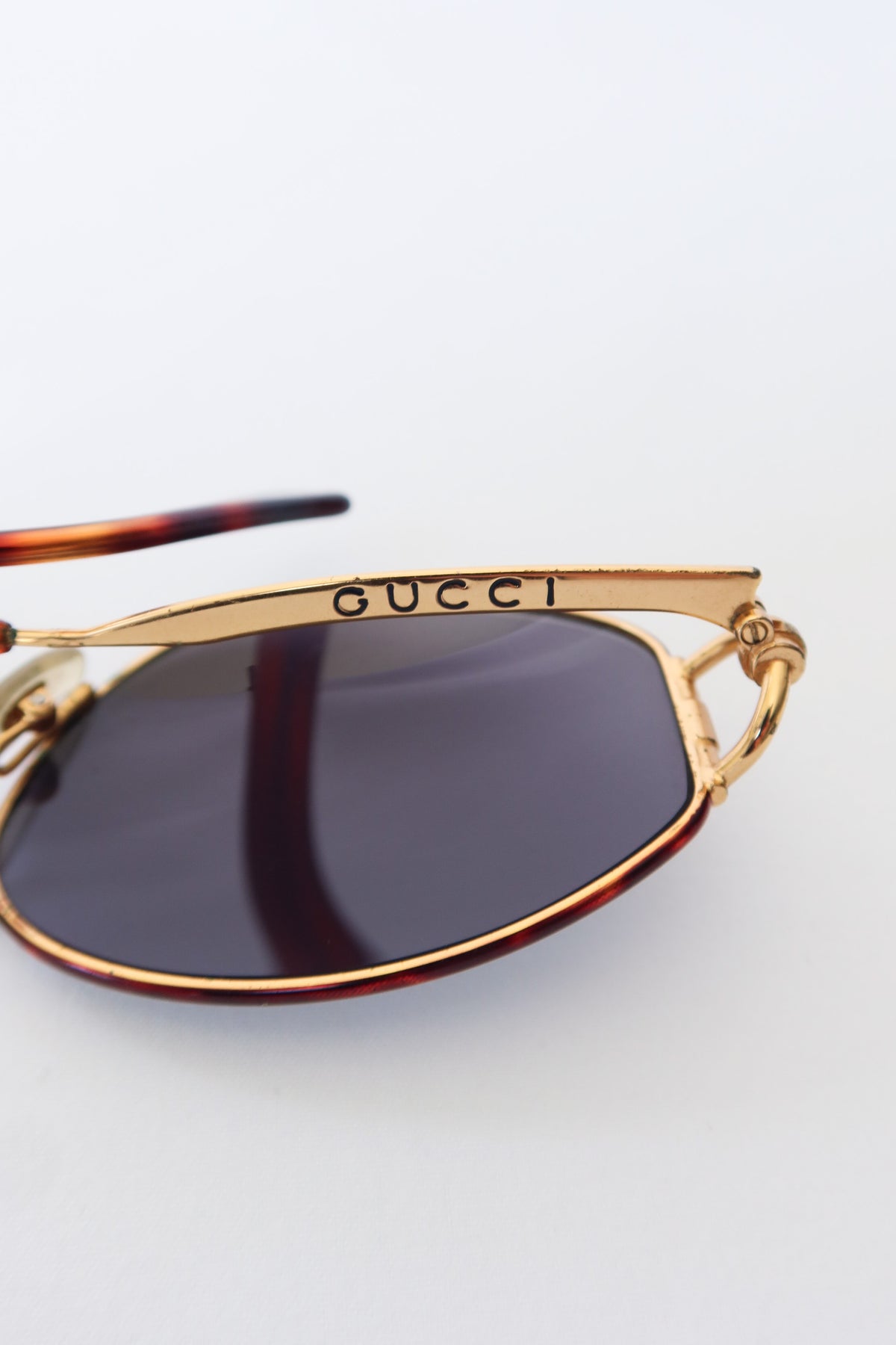 Gucci Gold Oval Knot Sunglasses