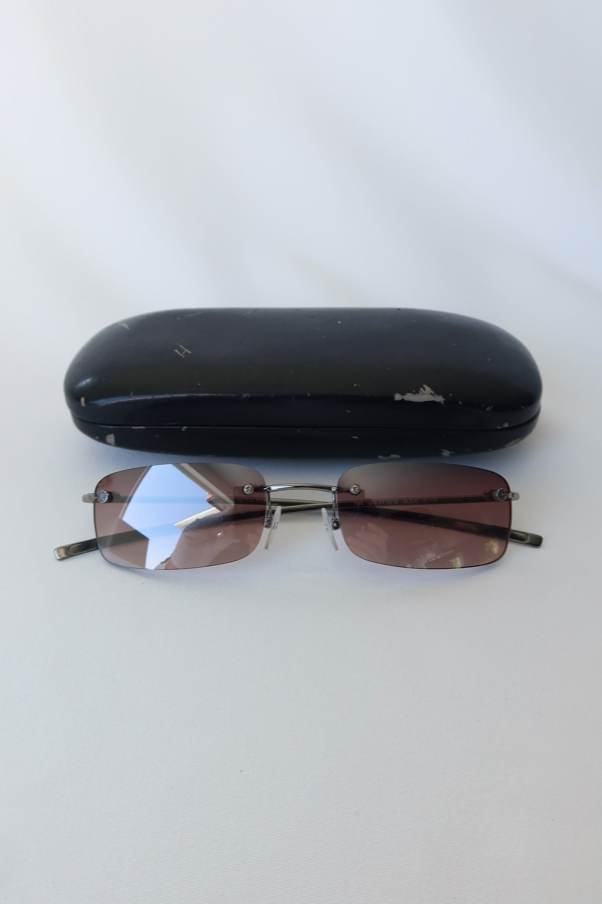 Gucci Rimless Rectangle Sunglasses · Case